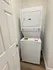 Convenient in-unit laundry with modern stackable washer and dryer in a cozy laundry nook.