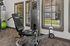 Modern fitness room with state-of-the-art equipment and bright natural light.