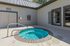 Inviting outdoor spa area with a circular hot tub, perfect for relaxation and unwinding in a serene setting.