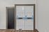 Modern laundry room with stacked washing and drying machines, featuring sleek wood flooring and a clean, minimal design.