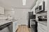 Modern kitchen with sleek granite countertops, stainless steel appliances, and elegant cabinetry.