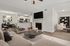 Elegant open-plan living area featuring a modern kitchen, cozy seating, and a stylish fireplace, perfect for relaxation and entertaining.