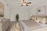Elegant bedroom with contemporary decor, featuring a plush bed, stylish dresser, ceiling fan, and modern artwork. Cozy and inviting atmosphere accentuated by soft lighting and a decorative plant.