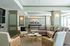Elegant and inviting living room featuring a plush sectional sofa, chic coffee table, and stylish armchairs, perfect for relaxation and entertainment.