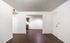 Inviting entryway leading to a bright, open living space with sleek hardwood floors and modern finishes.