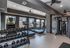 Modern fitness center featuring state-of-the-art cardio machines, free weights, and sleek design for optimal workouts.