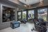 Modern fitness center featuring state-of-the-art exercise machines and vibrant outdoor views.