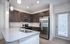 Modern kitchen with sleek cabinetry, stainless steel appliances, and elegant lighting, perfect for stylish cooking and entertaining.