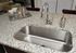 Elegant kitchen with a sleek granite countertop, stainless steel sink, and modern chrome faucet.