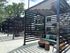 Modern outdoor pergola with stylish seating area, offering a serene and shaded retreat.