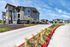 Modern Aspire Onion Creek apartment exterior with contemporary architecture, landscaped surroundings, and welcoming entrance.