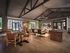 Luxurious open-concept living space with vaulted ceilings, modern furnishings, and abundant natural light.