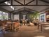 Luxurious open-concept living space with high ceilings, elegant wooden floors, and abundant natural light, perfect for entertaining.