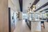 Modern open-concept kitchen with sleek cabinetry, stainless steel appliances, and elegant pendant lighting, offering a spacious and stylish cooking environment.