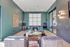 Chic modern lounge area with arcade games, stylish seating, and contemporary wall art.