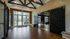 Bright and modern entryway with elegant barn-style doors, showcasing a stylish office space and welcoming natural light.