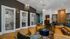 Chic modern lounge with stylish pendant lighting, vibrant wall designs, and comfortable seating areas perfect for relaxation and meetings.