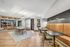 Elegant communal area with modern decor, featuring a cozy seating lounge, stylish dining tables, and warm ambient lighting.