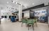 Contemporary apartment lobby featuring modern seating, vibrant wall art, and elegant lighting for a welcoming atmosphere.