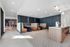 Chic and modern communal seating area with stylish booths and contemporary lighting, perfect for socializing or working.