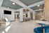 Elegant communal space featuring modern seating, stylish lighting, and a versatile dining area.