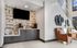 Chic lounge area with cozy chairs, stylish wall art, and modern coffee bar, elegantly decorated for comfort and relaxation.