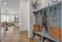 Inviting modern apartment entryway with cozy seating, stylish dining area, and abundant natural light.