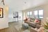Bright and airy living room featuring modern furniture, large windows with scenic views, and stylish decor for a cozy lifestyle.