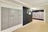 Modern apartment mailbox area with sleek design and secure mailboxes, featuring a stylish hallway and bright lighting.