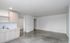 Bright and modern open-concept living space featuring sleek cabinetry and a chic minimalist design.