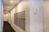 Elegant apartment hallway with modern mailboxes and soft ambient lighting, offering secure and convenient mail storage.