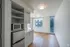 Bright and modern apartment kitchen with sleek cabinetry, stainless steel appliances, and ample natural light.