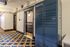 Charming apartment hallway featuring an elegant carpet design and a convenient Amazon Hub locker for easy package access.