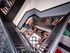 Artistic apartment stairwell with bold geometric patterns and vibrant colors, showcasing modern architectural flair.