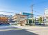 Charming Monticello apartment building exterior with modern architecture, abundant parking, and a vibrant urban setting.