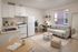 Charming modern studio apartment featuring an open kitchen, cozy living area with a plush sofa, and a chic workspace.