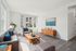 Bright, modern living room with sleek furniture and large windows, offering a welcoming and airy ambiance.