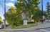 Charming urban setting at Nordic Pointe Apartments, surrounded by lush greenery on 22nd Ave with easy street access.