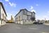 Charming modern townhouse in a quiet neighborhood with scenic views, ample parking, and elegant architectural design.