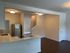 Modern kitchen with sleek stainless steel appliances, elegant countertops, and an inviting open floor plan.