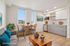 Chic, virtually staged apartment with natural light, featuring a cozy living area, stylish kitchen, and dining space with city views.