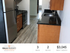 Modern kitchen with sleek granite countertops and stainless steel appliances in a spacious 3 bed, 2 bath apartment at an attractive rent.