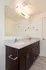Elegant bathroom with double vanity, marble countertop, and modern fixtures, perfect for a luxurious home experience.