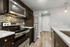 Modern kitchen with stainless steel appliances, sleek cabinetry, and stylish backsplash for a contemporary feel.