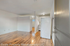 Inviting open-plan apartment with stylish wood floors, modern kitchen, and natural light.
