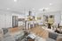 Modern open-plan living area showcasing a sleek kitchen with bar seating, elegant dining space, and cozy lounge in a bright, contemporary apartment.
