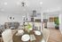Modern open-plan living space featuring a stylish kitchen with sleek appliances, inviting dining area, and cozy living room with chic decor.