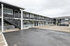 Charming two-story apartment complex with modern design and ample parking, ideal for convenient and stylish living.