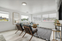 Contemporary living room with sleek furnishings, large windows offering natural light, and a stylish interior design.
