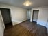 Inviting bedroom with elegant wood flooring and ample closet space, perfect for a cozy retreat.